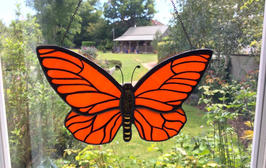 Orange stained glass butterfly sun catcher